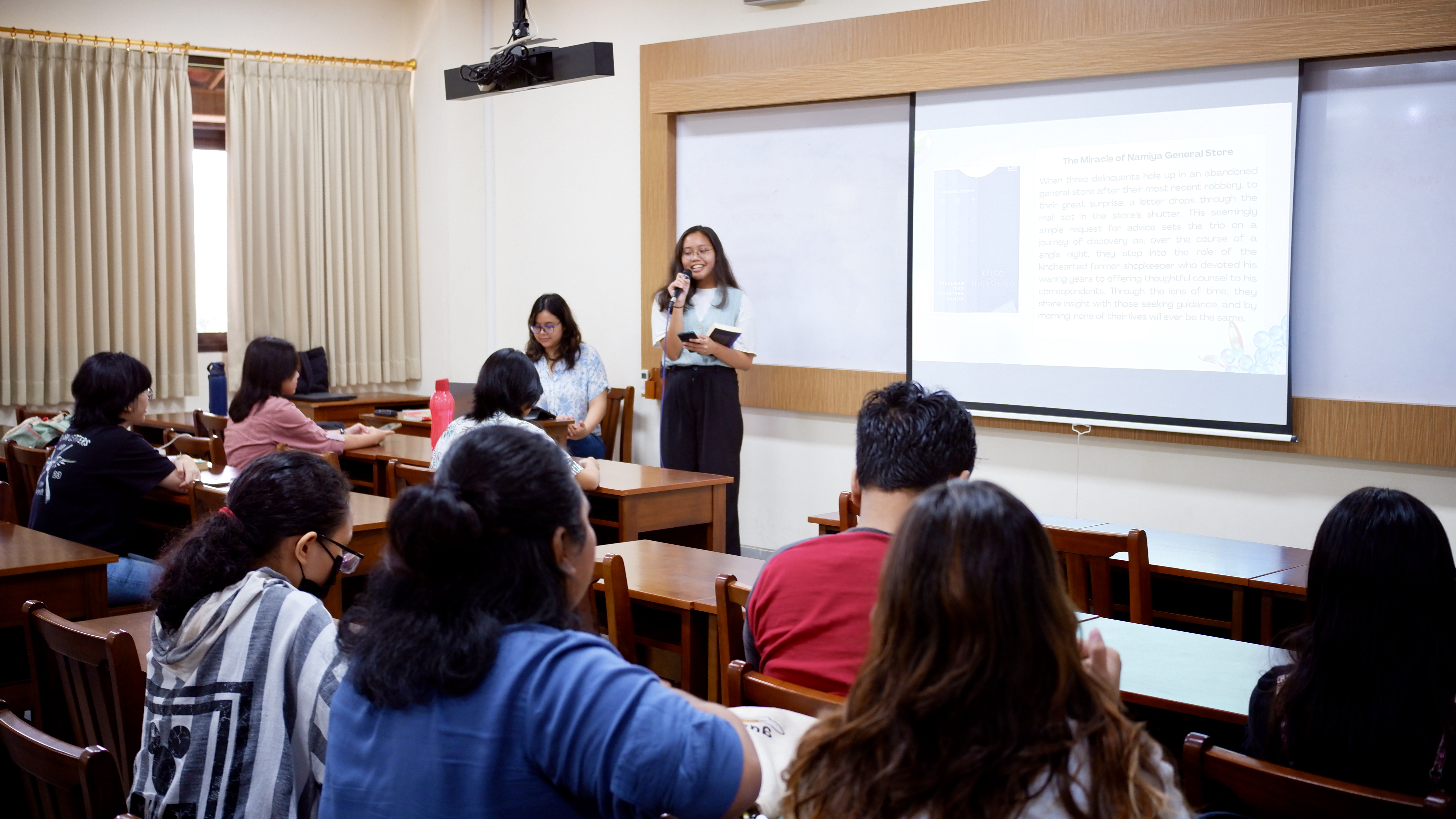 A student presenting a book that they read